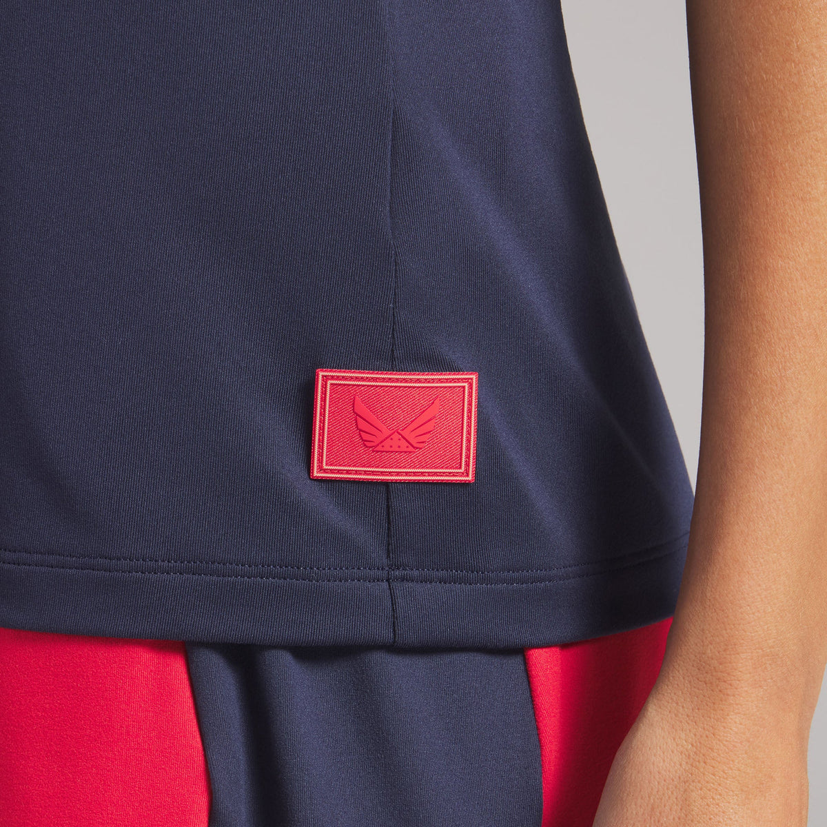 Women's Volition Solid Sleeveless Golf Polo